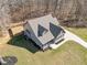 Charming aerial view of a modern craftsman house with a screened-in porch, lush green grass, and an enclosed backyard at 193 Jenny Ln, Timberlake, NC 27583