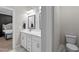Elegant bathroom featuring a double vanity, decorative wall accents, and doorway views to other rooms at 193 Jenny Ln, Timberlake, NC 27583