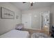 Bedroom featuring a bed, crib, closet, and open doorway leading to another room at 193 Jenny Ln, Timberlake, NC 27583