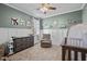 A Bedroom with a gray crib, gray dresser, comfortable chair and neutral carpet, perfect for a little one at 193 Jenny Ln, Timberlake, NC 27583