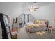 Bright bedroom with a colorful bed, dresser and large mirror, creating a playful atmosphere at 193 Jenny Ln, Timberlake, NC 27583