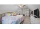 Bright bedroom with a colorful bed, dresser and an entrance to another room at 193 Jenny Ln, Timberlake, NC 27583