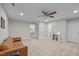 A spacious bonus room with a brown sofa and neutral carpet, perfect for entertaining at 193 Jenny Ln, Timberlake, NC 27583