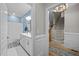 Entryway view into the home, showcasing a hall bathroom and the staircase at 193 Jenny Ln, Timberlake, NC 27583