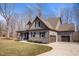 A well-maintained home showcases a manicured lawn, attached garage, and neutral gray color scheme at 193 Jenny Ln, Timberlake, NC 27583