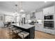 Modern kitchen boasts a large island, stainless steel appliances, and pendant lighting at 193 Jenny Ln, Timberlake, NC 27583