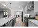 Open kitchen features an island and stainless steel appliances with a dining area in the background at 193 Jenny Ln, Timberlake, NC 27583
