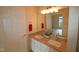 Double vanity bathroom with granite countertops and modern fixtures at 2520 Friedland # 202, Raleigh, NC 27617