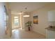 Dining area with tile flooring, a modern pendant light, and a large window, ideal for entertaining at 2520 Friedland # 202, Raleigh, NC 27617