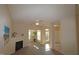 Spacious living room with fireplace and lots of natural light from windows at 2520 Friedland # 202, Raleigh, NC 27617