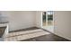 Bright dining space featuring hardwood floors, sliding glass doors, and views of the backyard at 2562 Summersby Dr, Mebane, NC 27302