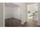 Hallway showing wood flooring leading to an office and dining area at 2562 Summersby Dr, Mebane, NC 27302