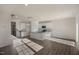 An open concept kitchen featuring modern white cabinets, stainless appliances, and a central island at 2562 Summersby Dr, Mebane, NC 27302