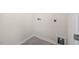 A compact laundry area with connections, space for appliances and neutral paint at 2562 Summersby Dr, Mebane, NC 27302