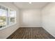 Bright bedroom showing natural light, hardwood floors, and neutral walls at 2573 Summersby Dr, Mebane, NC 27302