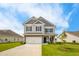 Charming two-story home with a well-manicured lawn and attached two car garage at 27 Meath Ct # 215, Clayton, NC 27520