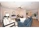 Cozy living room features a modern fireplace, stylish seating, and a decorative fan at 27 Meath Ct # 215, Clayton, NC 27520