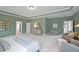 Spacious main bedroom with carpet, tray ceiling, dresser, and ensuite bathroom at 27 Meath Ct # 215, Clayton, NC 27520