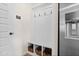 Practical mudroom with built-in bench, storage baskets, and access to the garage at 27 Meath Ct # 215, Clayton, NC 27520