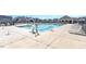 Community pool featuring crystal blue water, a pool lift, and plenty of seating at 27 Meath Ct # 215, Clayton, NC 27520