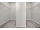 Spacious walk-in closet featuring wire shelving and neutral carpeting at 27 Meath Ct # 215, Clayton, NC 27520