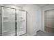 Bathroom featuring a frameless glass shower and a view of a walk-in closet at 2735 Luxborough Ln, Mebane, NC 27302