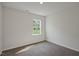 Bedroom with carpeted floors, white walls, and a window with green views at 2735 Luxborough Ln, Mebane, NC 27302