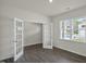 Flex room with hardwood floors, white walls, a window, and glass French doors at 2735 Luxborough Ln, Mebane, NC 27302
