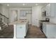 Kitchen featuring gray cabinets, an island, stainless appliances, and hardwood floors at 2735 Luxborough Ln, Mebane, NC 27302