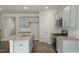 Kitchen featuring gray cabinets, an island, stainless appliances, and hardwood floors at 2735 Luxborough Ln, Mebane, NC 27302