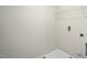 Bright laundry room with a metal rack for storage above the utility sink at 2735 Luxborough Ln, Mebane, NC 27302