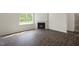 Living area featuring hardwood floors, a fireplace, and lots of natural light at 2735 Luxborough Ln, Mebane, NC 27302