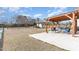 Large backyard with a wooden pergola, hammock, and plenty of space for outdoor activities at 32 Colson Dr, Garner, NC 27529