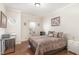 Comfortable bedroom with hardwood floors, a work desk, window, and neutral decor at 32 Colson Dr, Garner, NC 27529