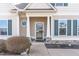 Welcoming front entrance featuring a decorative glass door, white columns, and manicured landscaping at 32 Colson Dr, Garner, NC 27529