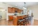 Modern kitchen with granite countertops, stainless steel appliances, a breakfast bar and wood cabinetry at 32 Colson Dr, Garner, NC 27529