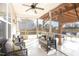 Relaxing screened-in porch with wicker furniture, a ceiling fan, and natural light at 32 Colson Dr, Garner, NC 27529