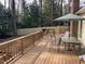 Spacious deck, perfect for outdoor dining and entertaining, complete with a grill and a view of the backyard at 3616 Blue Ridge Rd, Raleigh, NC 27612