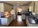 Traditional kitchen with white cabinets, laminate countertops, stainless steel appliances, and hardwood floors at 3616 Blue Ridge Rd, Raleigh, NC 27612