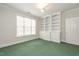 Bedroom featuring built-in shelving and a large window at 3700 Baron Cooper Pass # 108, Raleigh, NC 27612