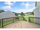 Wood deck overlooking a green lawn and quiet neighborhood street at 378 Oak Alley Trl, Clayton, NC 27527