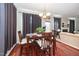 Inviting dining area with wood table, comfortable seating, and natural light at 378 Oak Alley Trl, Clayton, NC 27527