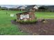 Stone sign for East Clayton Dog Park surrounded by mulch and greenery at 378 Oak Alley Trl, Clayton, NC 27527