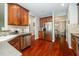 Well-lit kitchen featuring stainless steel appliances and beautiful hardwood flooring at 378 Oak Alley Trl, Clayton, NC 27527