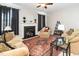 Cozy living room featuring a fireplace, comfortable seating, and a decorative rug at 378 Oak Alley Trl, Clayton, NC 27527