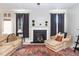 Inviting living room with a fireplace, plush seating, and soft, natural lighting at 378 Oak Alley Trl, Clayton, NC 27527