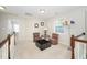 Bright loft area with carpeted floors, natural light and space for seating at 378 Oak Alley Trl, Clayton, NC 27527