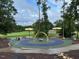Colorful playground with various play structures and benches surrounded by trees at 378 Oak Alley Trl, Clayton, NC 27527