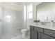 Modern bathroom with a glass-enclosed shower, sleek vanity, and elegant finishes at 3913 Berkeley Town Ln, Fuquay Varina, NC 27526