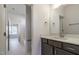 Bathroom featuring modern vanity with white countertop, stainless faucet and view to tub at 3913 Berkeley Town Ln, Fuquay Varina, NC 27526